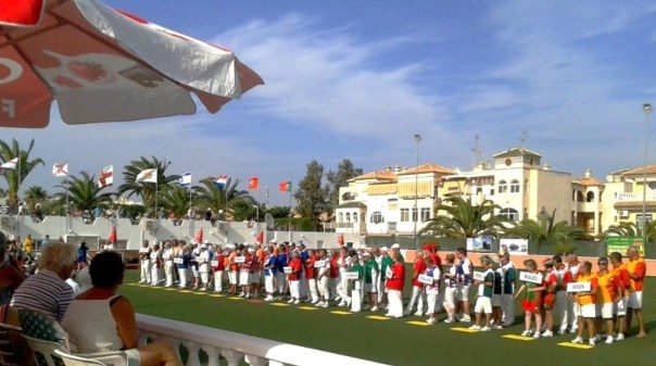 Photo of players at opening ceremony of lawn bowls tournament